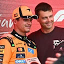 Artemis II astronaut Reid Wiseman presented Lando with his Sprint win trophy. Swipe for more images
