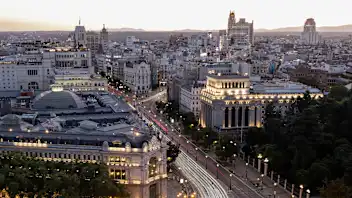 A general view of Madrid cityscape illuminated at dusk is pictured on July 24, 2025. (Photo by