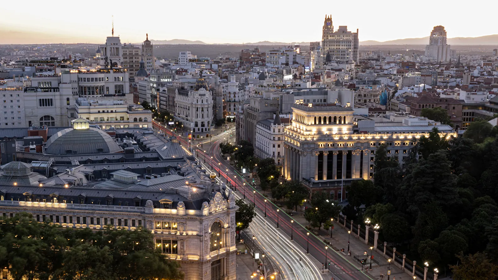A general view of Madrid cityscape illuminated at dusk is pictured on July 24, 2025. (Photo by