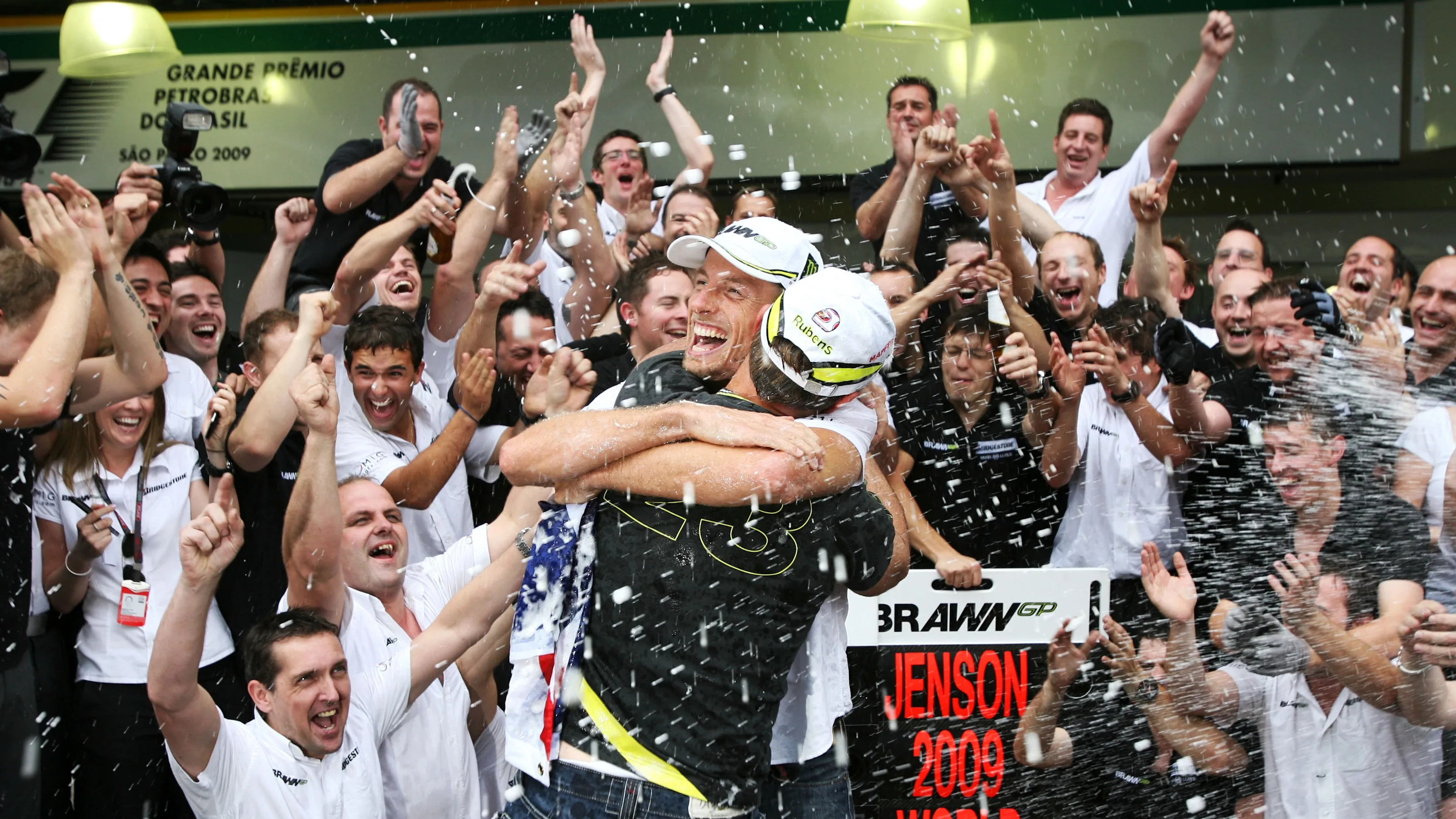 Rubens Barrichello (BRA) Brawn Grand Prix and World Champion Jenson Button (GBR) Brawn Grand Prix