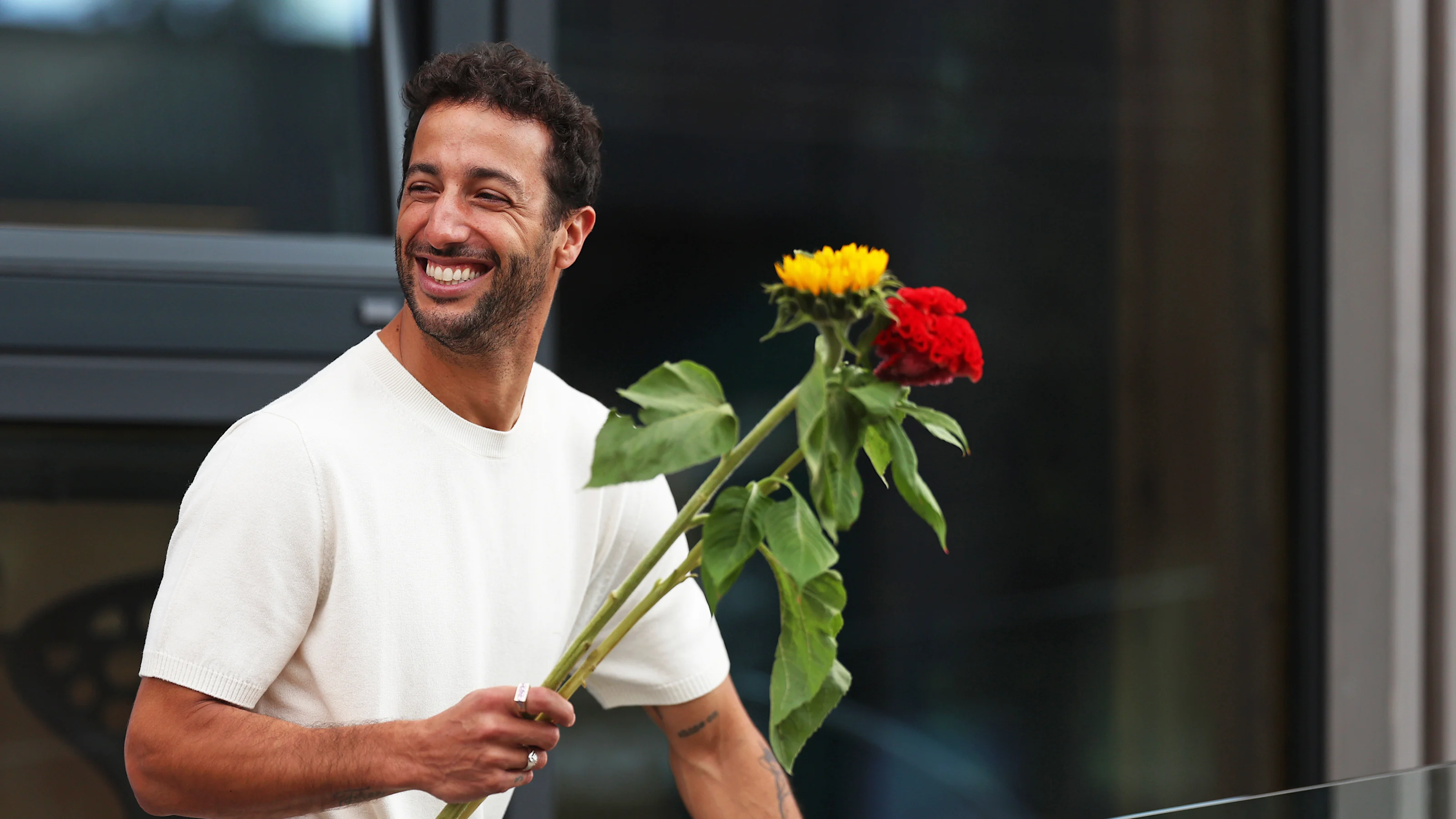 ZANDVOORT, NETHERLANDS - AUGUST 25: Daniel Ricciardo of Australia and Scuderia AlphaTauri holds