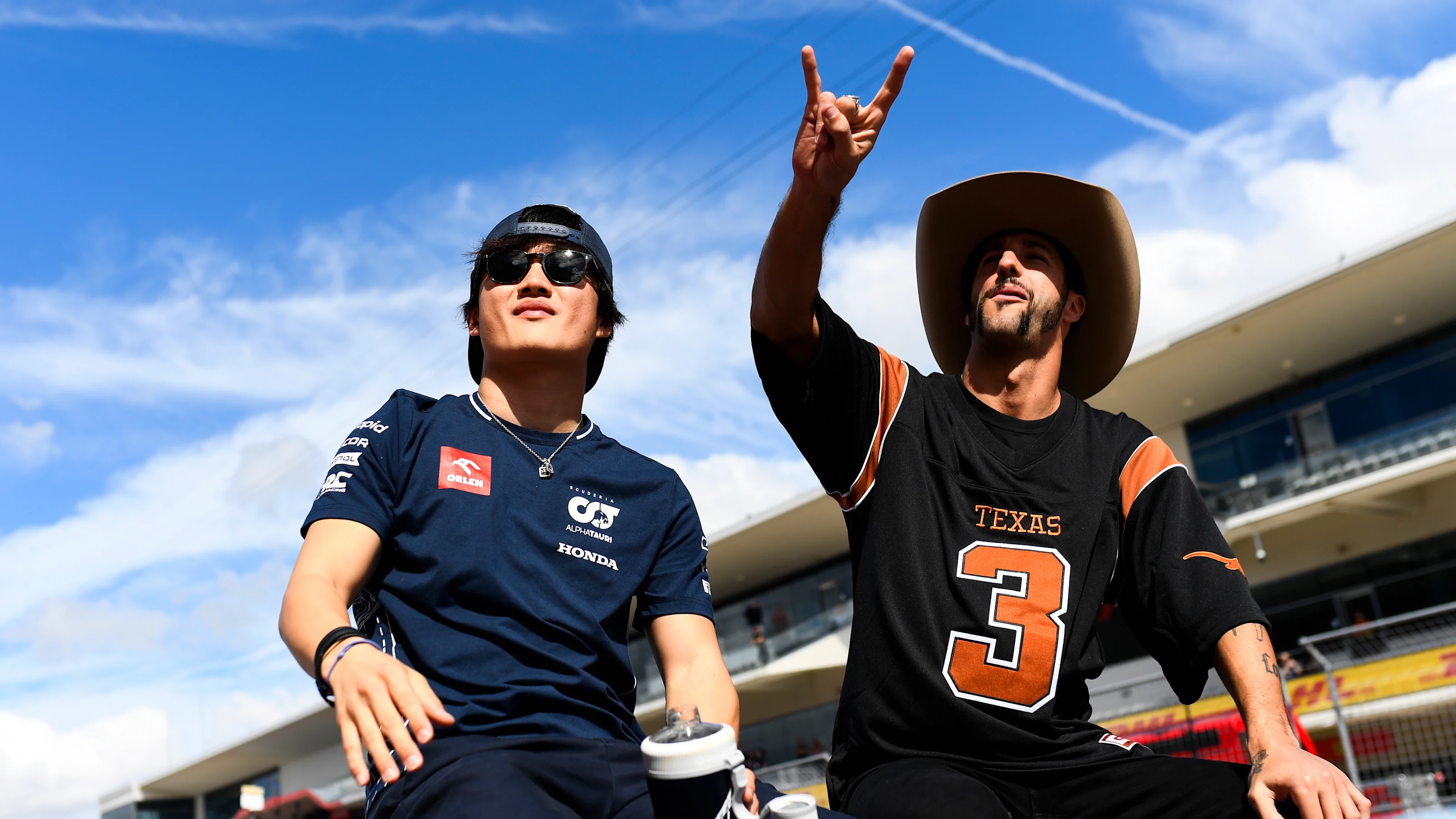 AUSTIN, TEXAS - OCTOBER 22: Yuki Tsunoda of Japan and Scuderia AlphaTauri and Daniel Ricciardo of