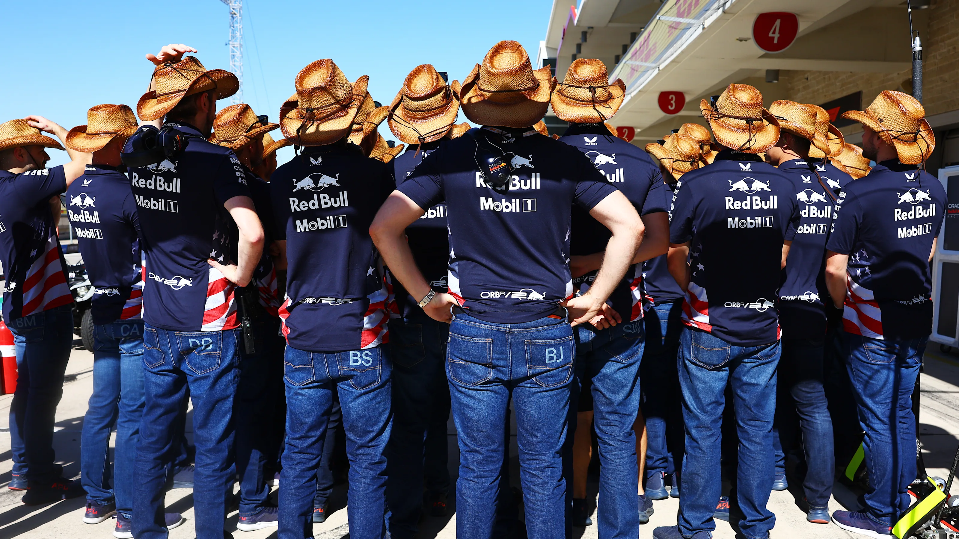 AUSTIN, TEXAS - OCTOBER 20: The Oracle Red Bull Racing team wear cowboy hats in the Paddock prior