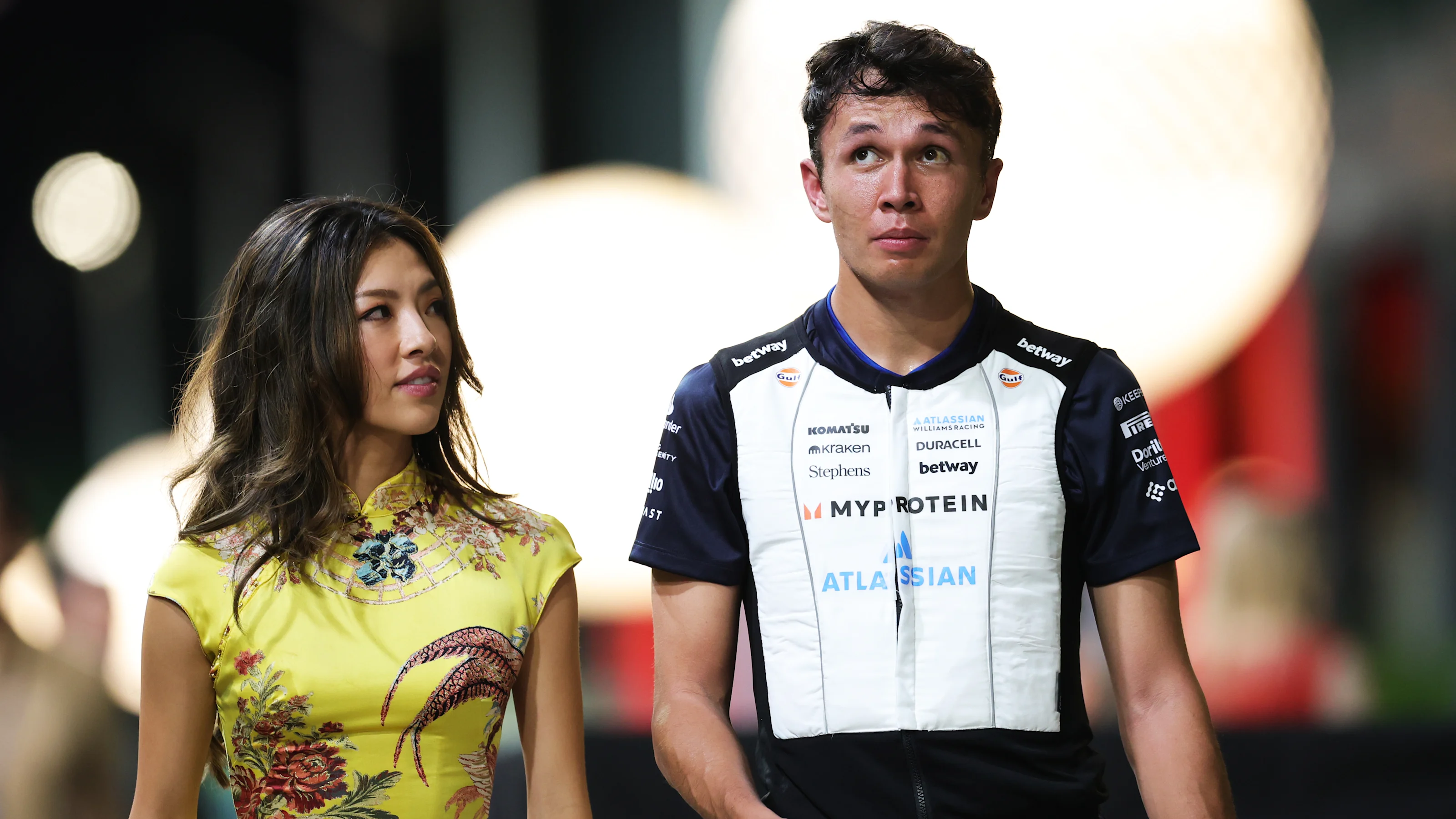 SINGAPORE, SINGAPORE - OCTOBER 05: Alexander Albon of Thailand and Williams and Lily Muni he in the