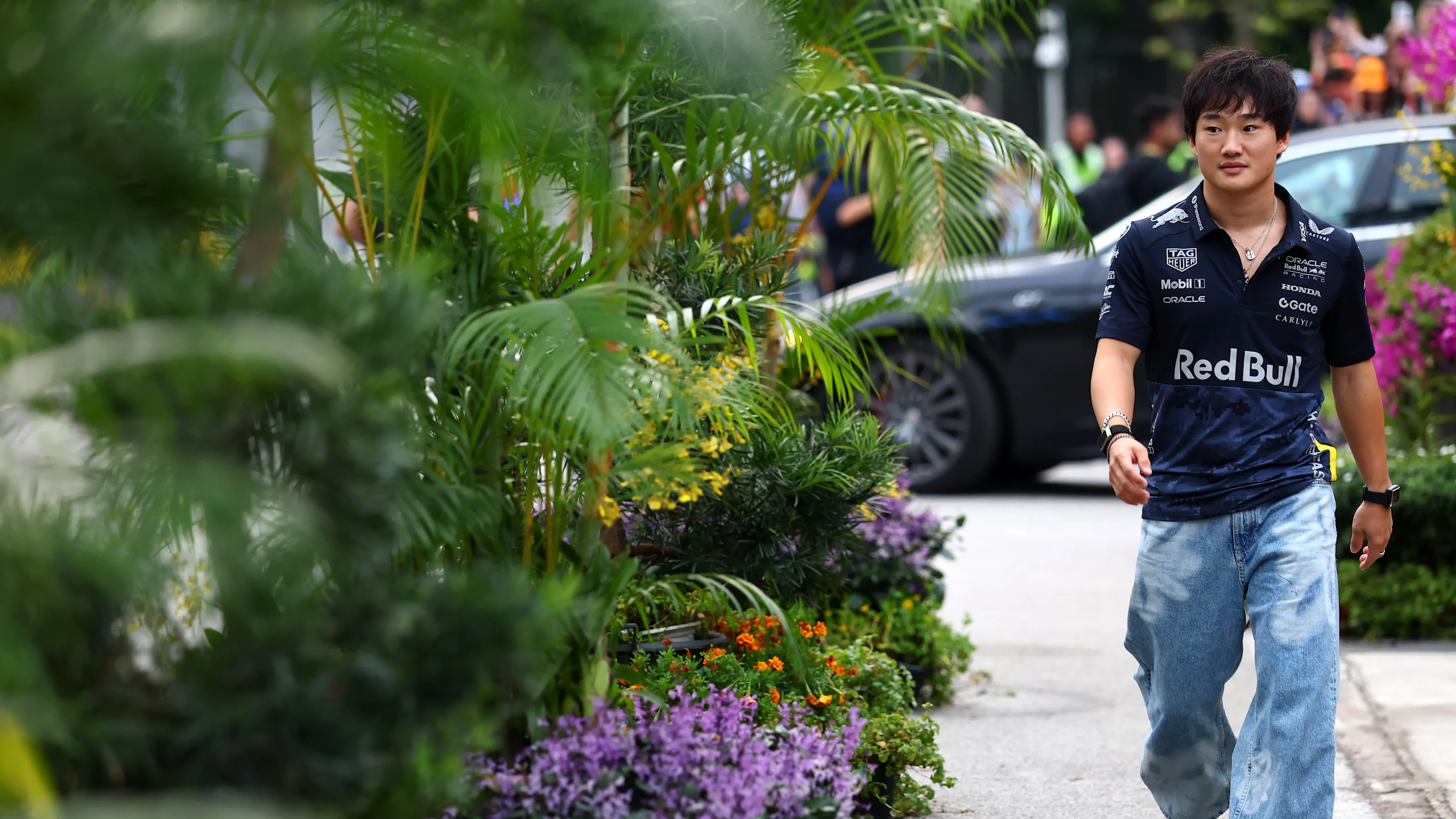 SINGAPORE, SINGAPORE - OCTOBER 02: Yuki Tsunoda of Japan and Oracle Red Bull Racing arrives in the