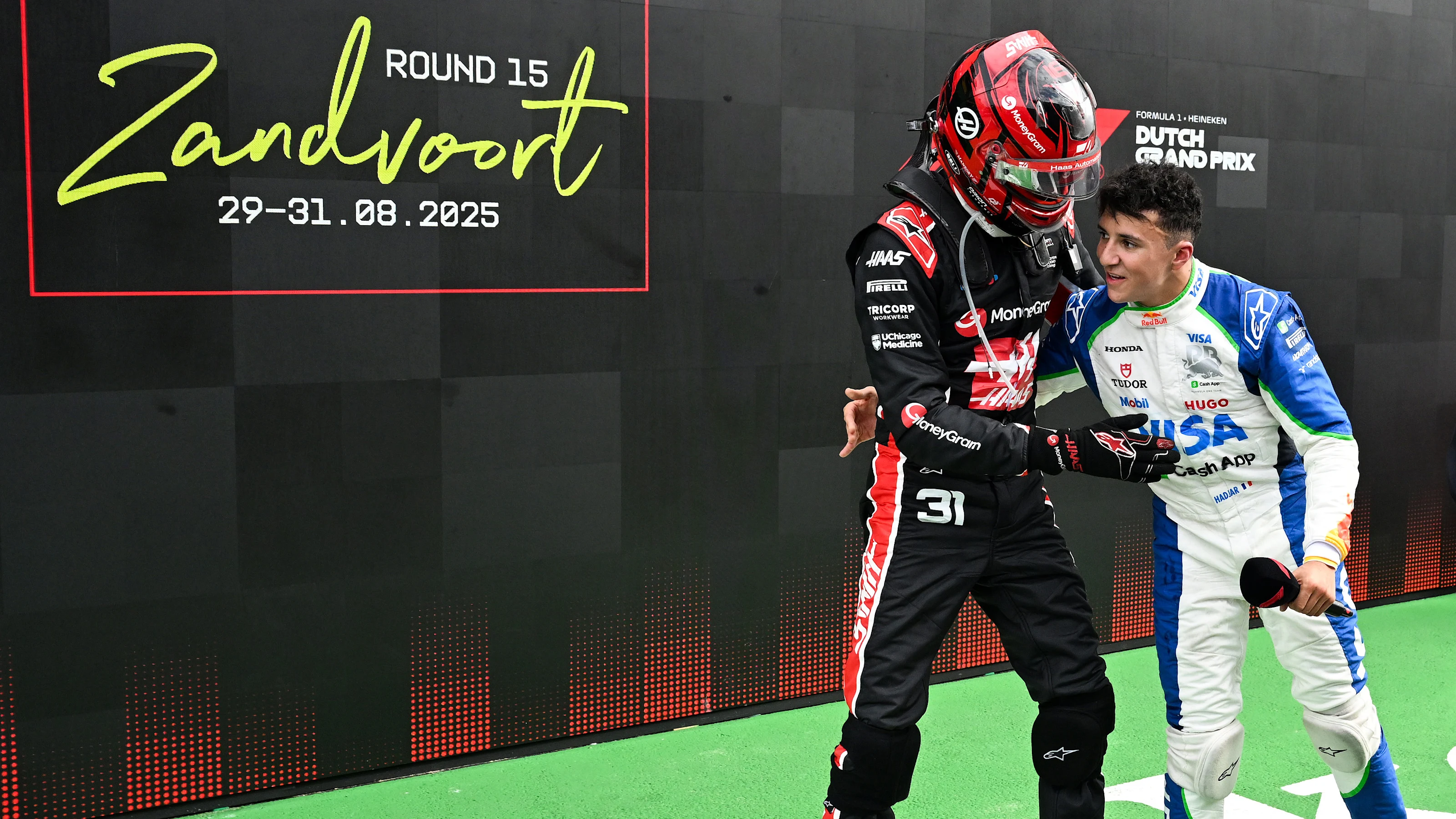 ZANDVOORT, NETHERLANDS - AUGUST 31: Tenth placed Esteban Ocon of France and Haas F1 congratulates