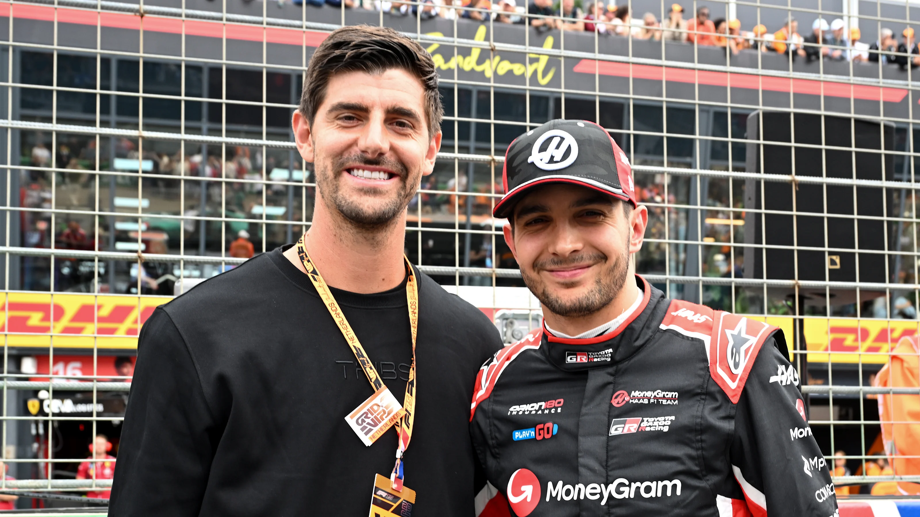 ZANDVOORT, NETHERLANDS - AUGUST 31: Thibaut Courtois and Esteban Ocon of France and Haas F1 on the