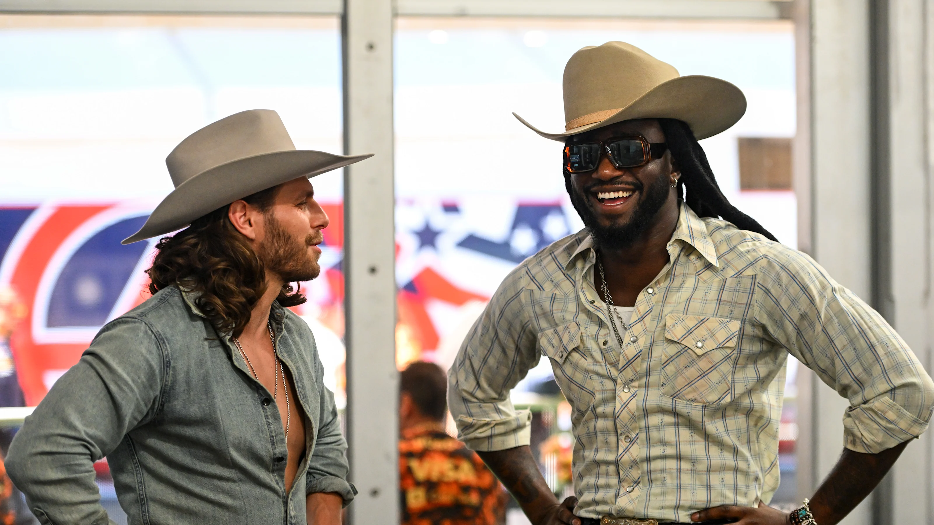 AUSTIN, TEXAS - OCTOBER 19: Warren Zeiders and Shaboozey in the Visa Cash App Racing Bulls