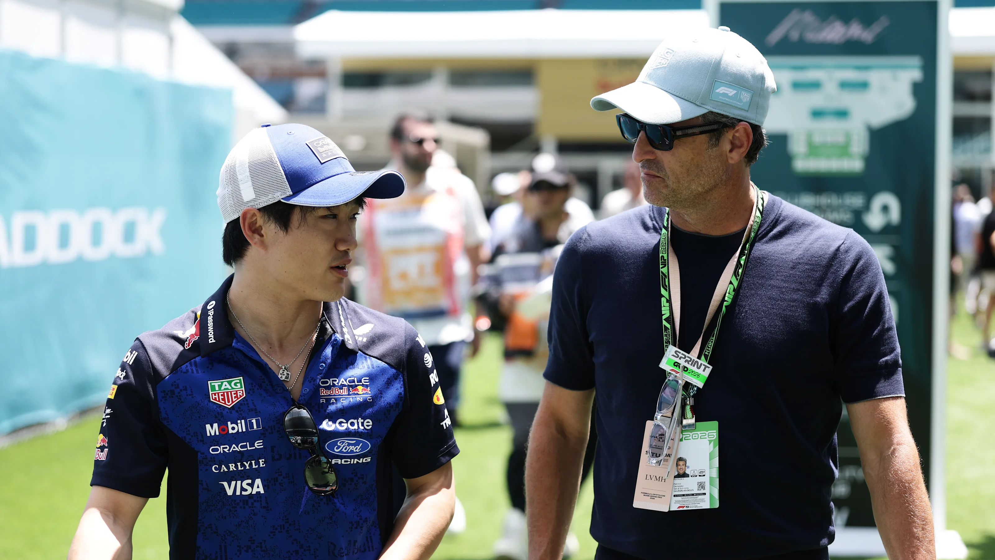 MIAMI, FLORIDA - MAY 02: Yuki Tsunoda of Japan and Oracle Red Bull Racing walks with Patrick