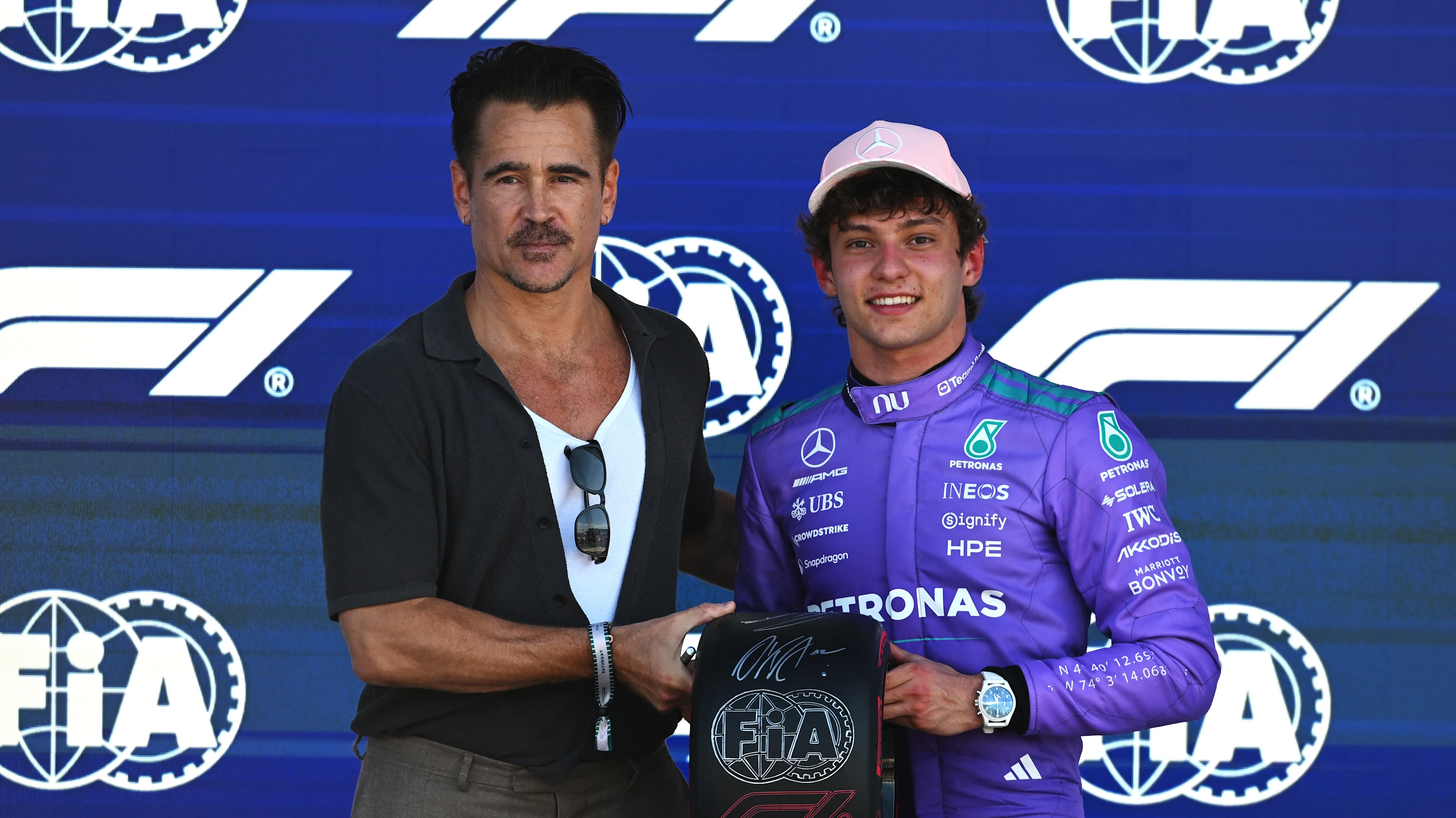 MIAMI, FLORIDA - MAY 02: Colin Farrell presents Pole position qualifier Andrea Kimi Antonelli of