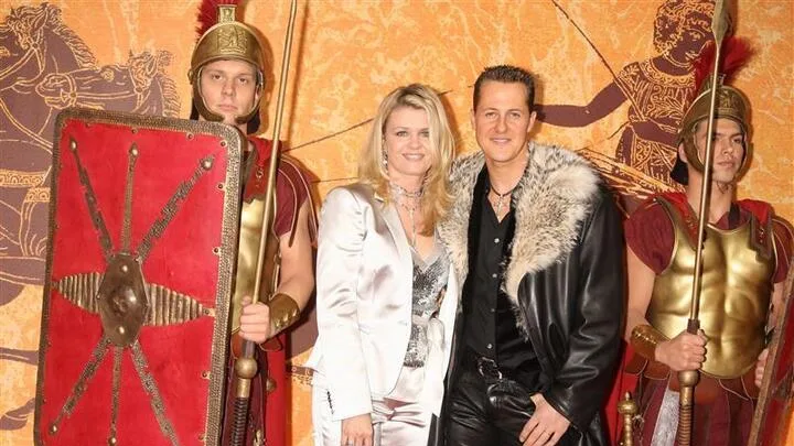 Michael, with wife Corinna, at a film premiere wearing eye-catching leather and fur. Swipe to see more images