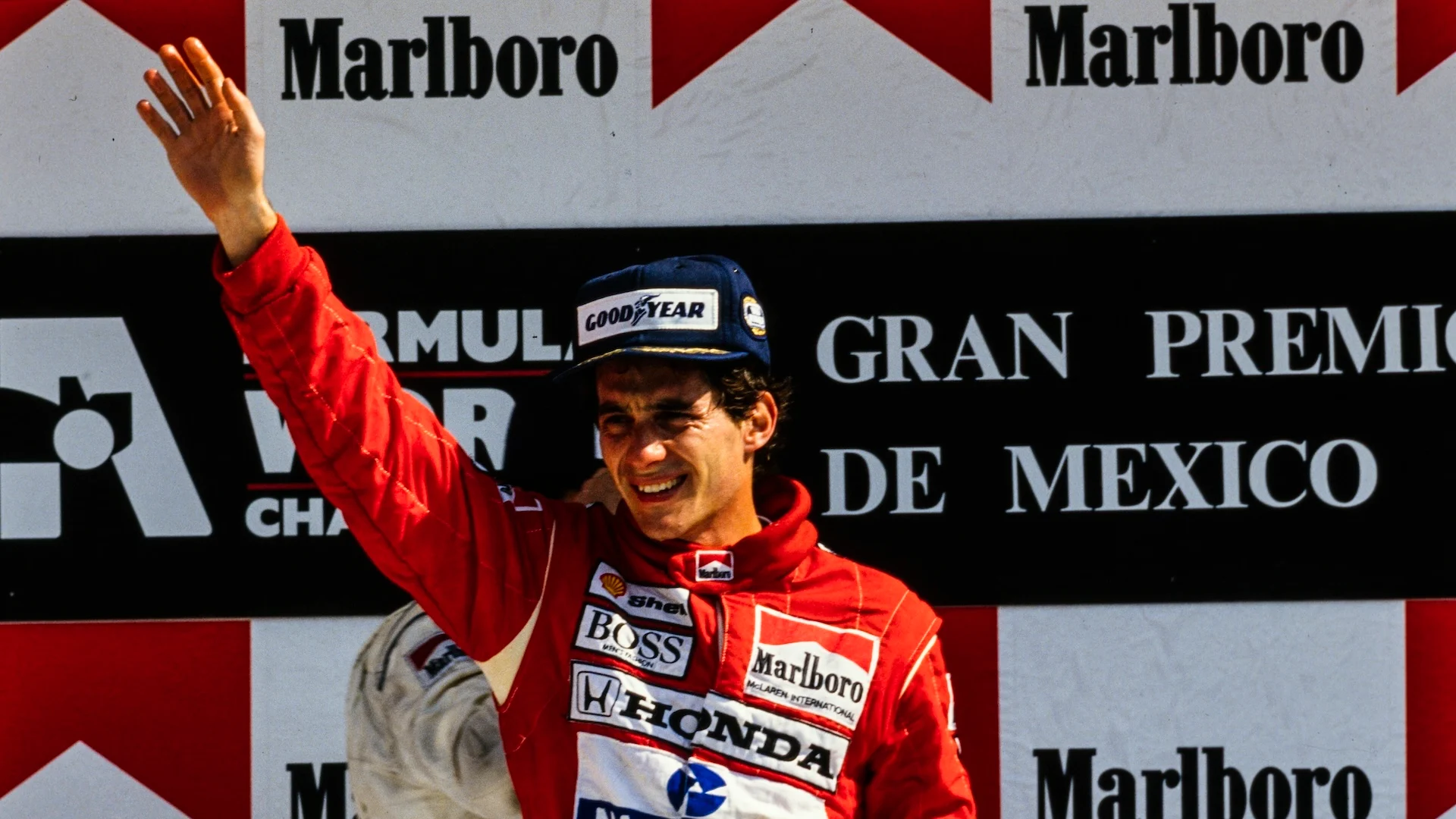 AUTODROMO HERMANOS RODRIGUEZ, MEXICO - MAY 28: Ayrton Senna, 1st position, waves on the podium