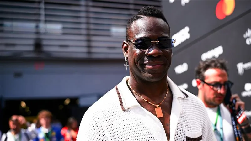 Mario Balotelli turned heads as he made his way through the paddock – the Italian striker drawing as many cameras as the cars. Swipe for more