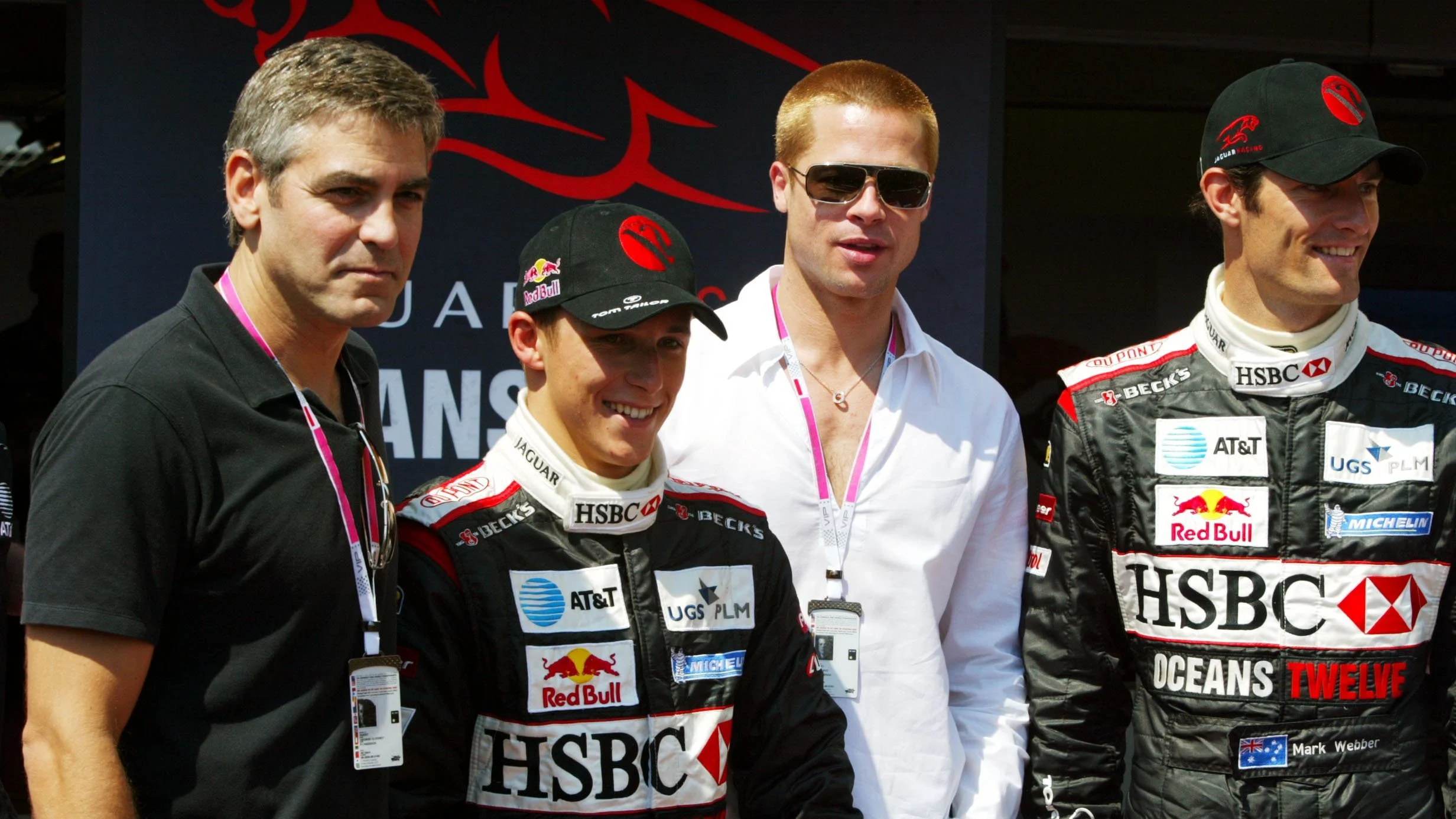 Promoting the film Oceans Twelve with the Jaguar team (L to R): George Clooney (USA) Actor;
