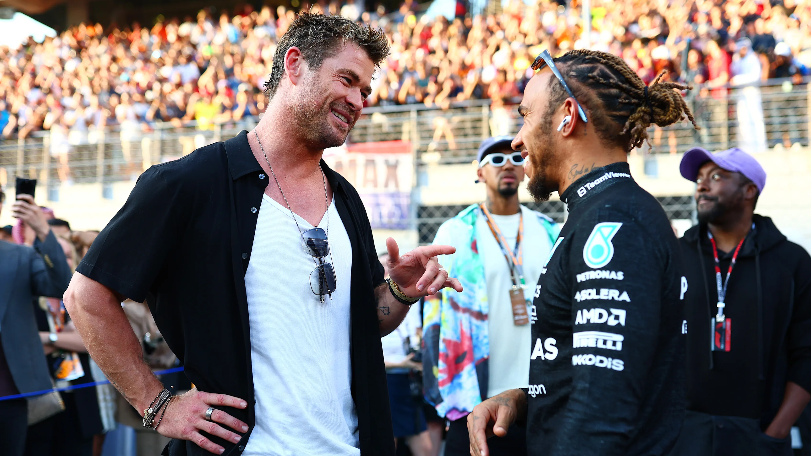 ABU DHABI, UNITED ARAB EMIRATES - NOVEMBER 26: Chris Hemsworth talks to Lewis Hamilton of Great