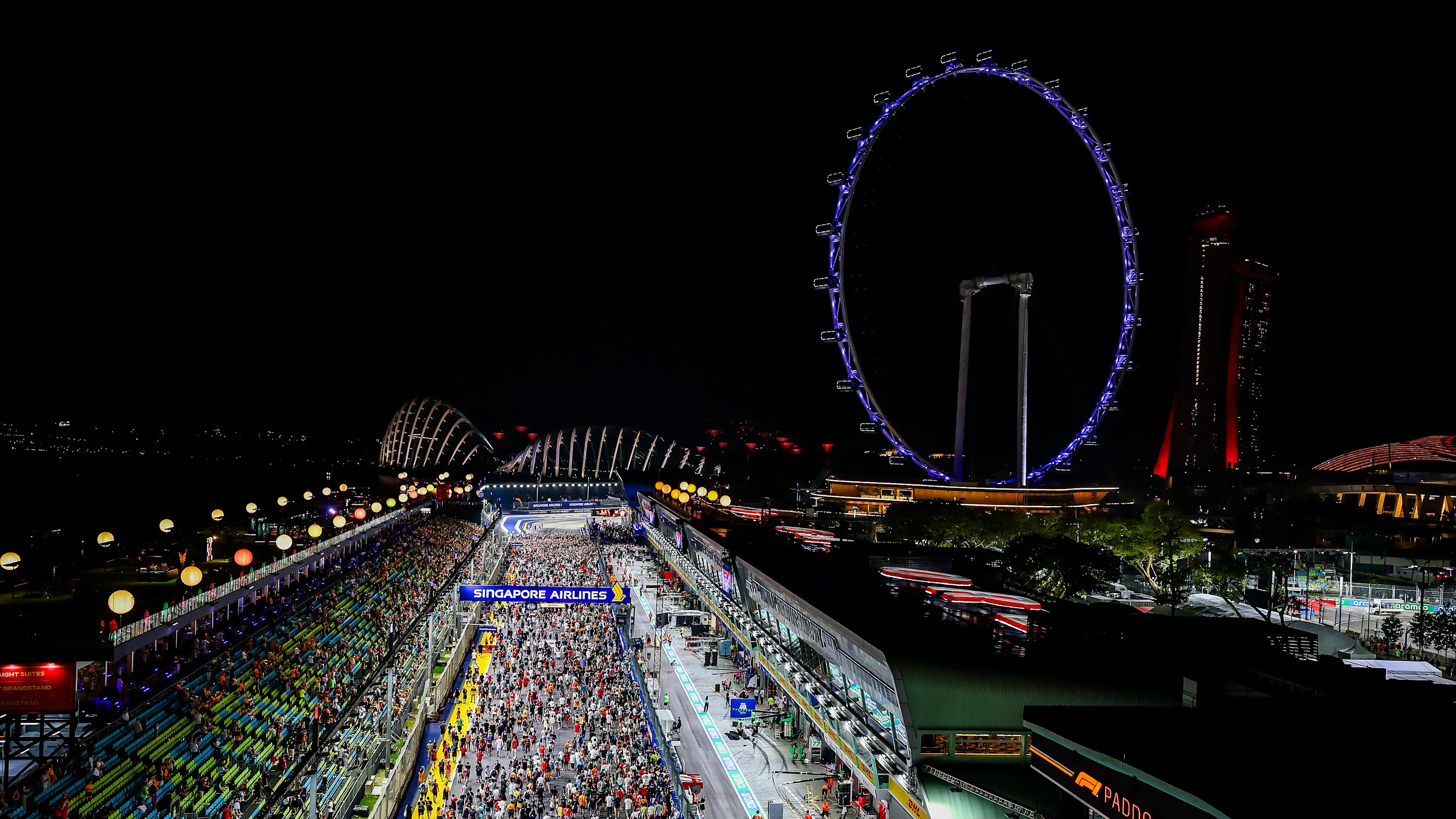 SINGAPORE, SINGAPORE - SEPTEMBER 22: Fans invade the track after the F1 Grand Prix of Singapore at
