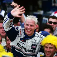 Third placed Jacques Villeneuve (CDN) Williams celebrates becoming the World Champion with the