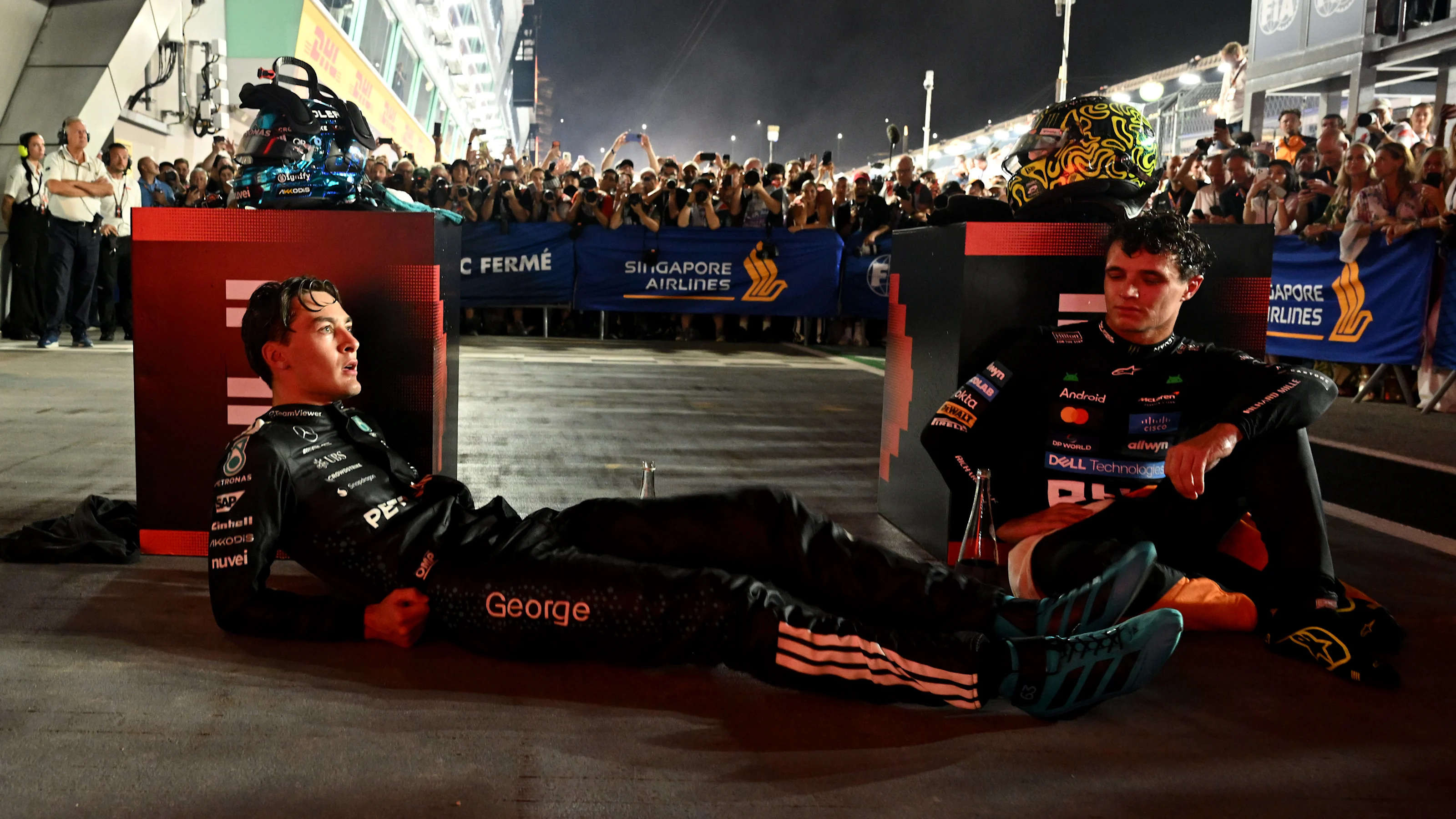 SINGAPORE, SINGAPORE - OCTOBER 05: Race winner George Russell of Great Britain and Mercedes AMG