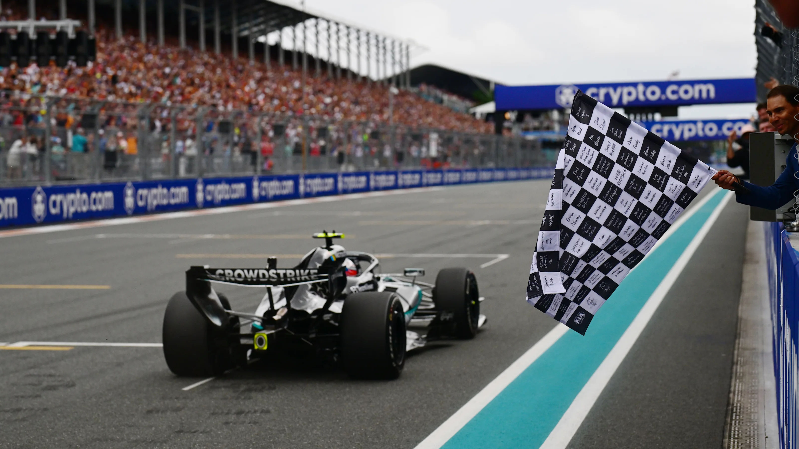 MIAMI, FLORIDA - MAY 03: Rafael Nadal waves the chequered flag for Race winner Andrea Kimi
