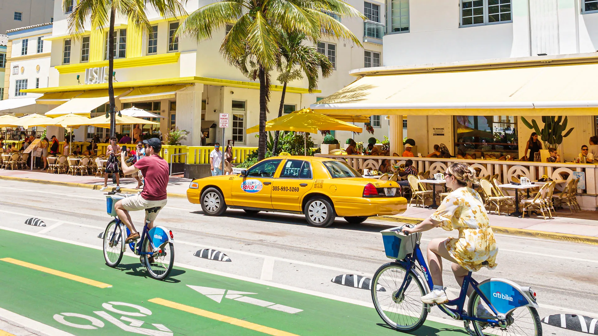 Miami Beach, Florida, Ocean Drive Art Deco District, bike lane bicyclists on citibikes near hotels
