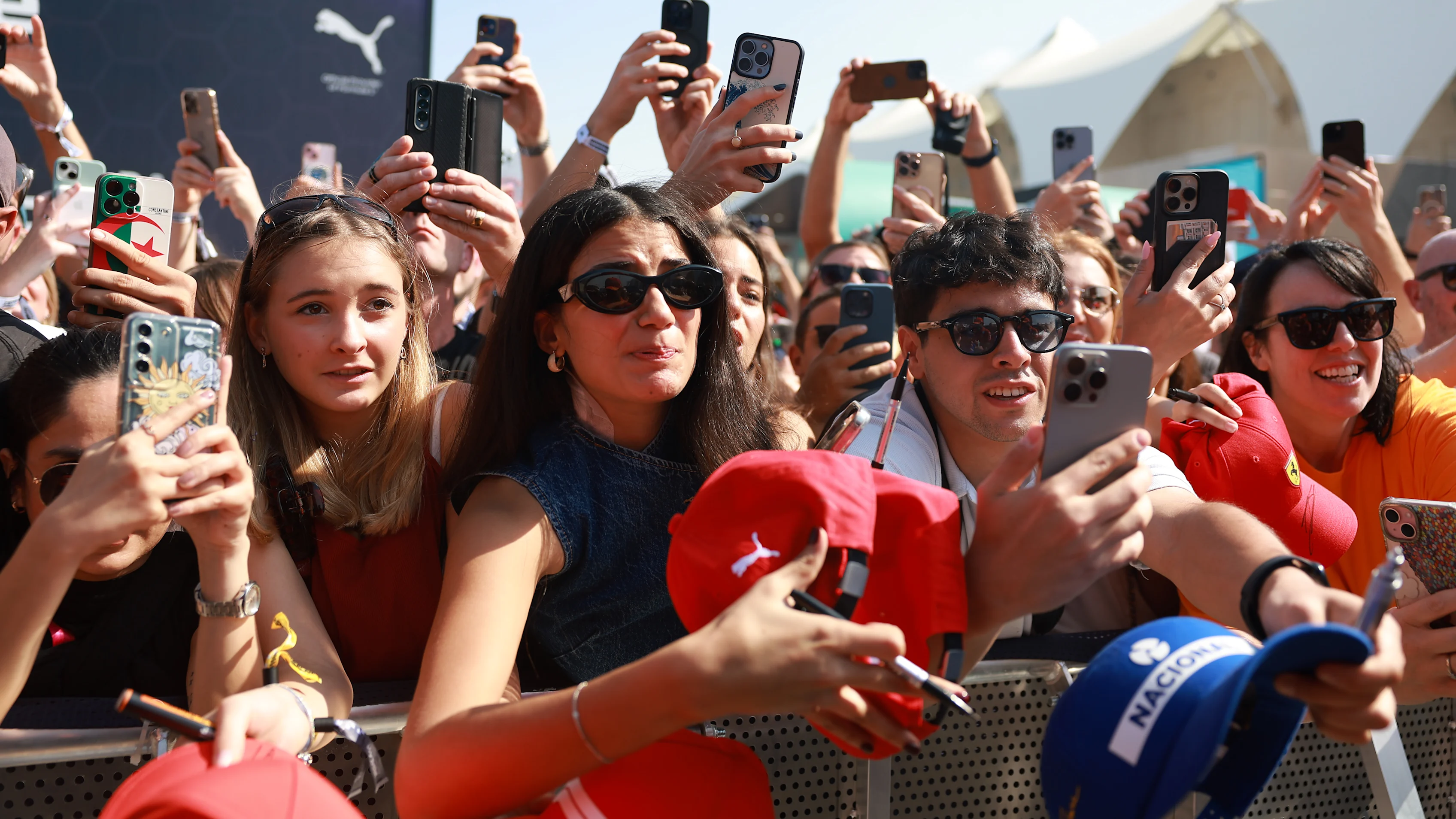 ABU DHABI, UNITED ARAB EMIRATES - DECEMBER 07: Fans enjoy the atmosphere at the fanstage prior to