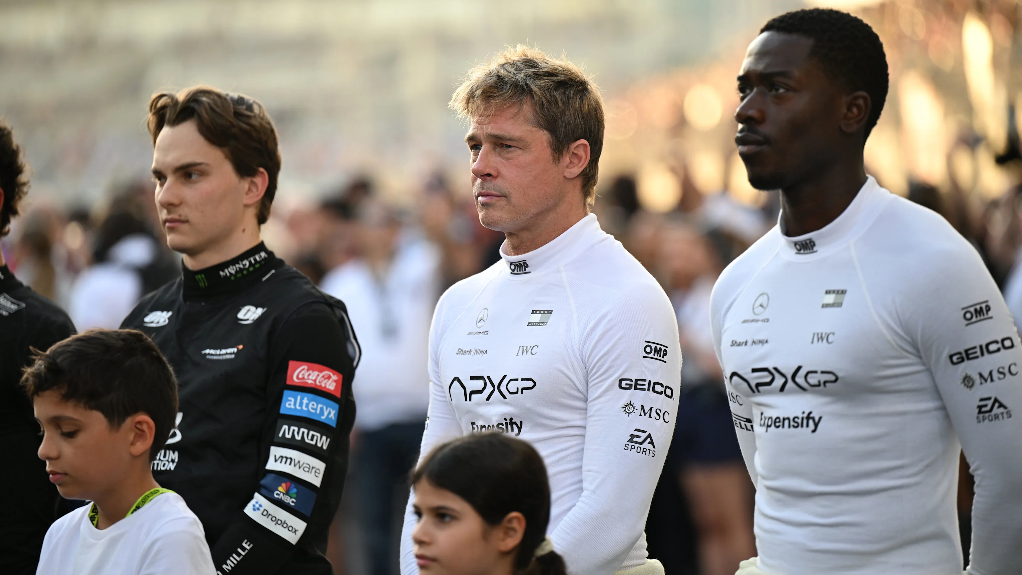 ABU DHABI, UNITED ARAB EMIRATES - DECEMBER 08: Brad Pitt and Damson Idris with Oscar Piastri,