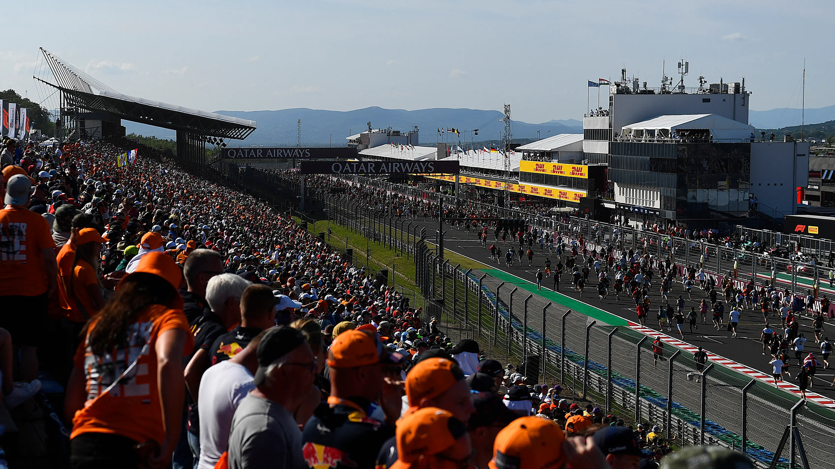 BUDAPEST, HUNGARY - JULY 23: Fans run onto the track for the podium celebration during the F1 Grand
