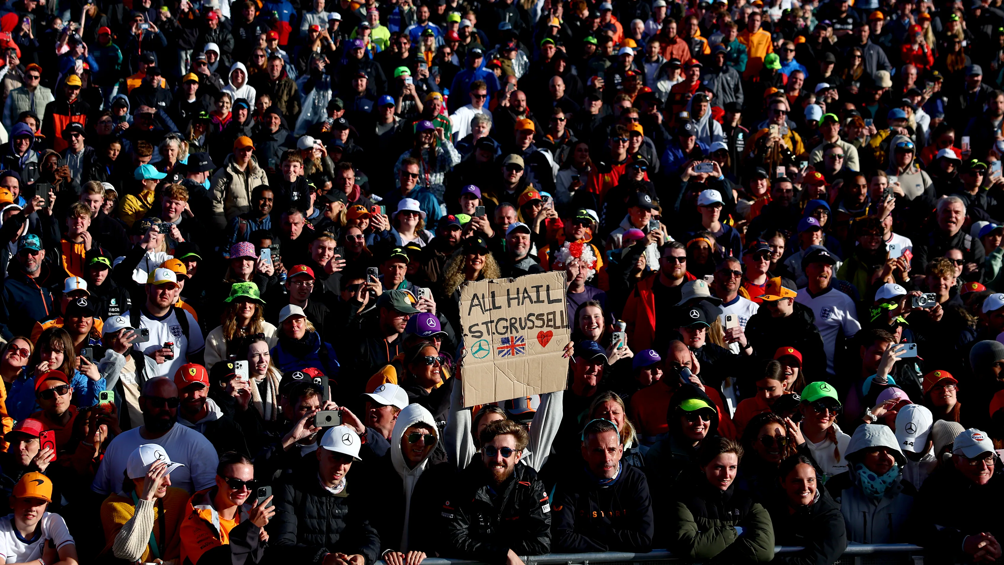NORTHAMPTON, ENGLAND - JULY 06: Fans enjoy the atmosphere at the fanstage after qualifying ahead of