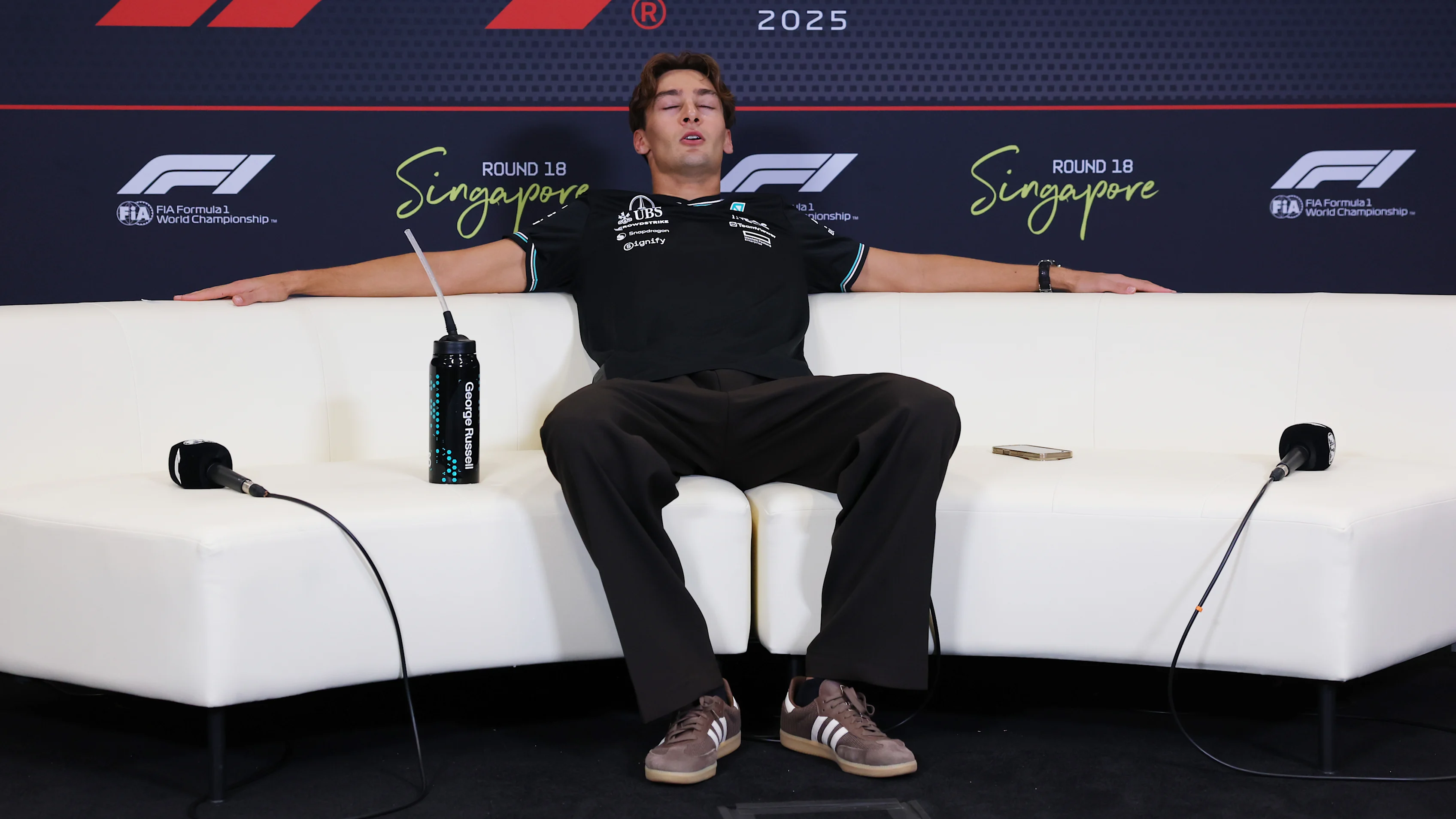 SINGAPORE, SINGAPORE - OCTOBER 05: Race winner George Russell of Great Britain and Mercedes AMG