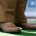 AUSTIN, TEXAS - OCTOBER 19: Daniel Ricciardo of Australia and Scuderia AlphaTauri wears a pair of