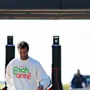 NORTHAMPTON, ENGLAND - JULY 04: Daniel Ricciardo of Australia and Visa Cash App RB walks in the