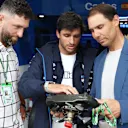 Sainz gave compatriots Nadal and Rahm a lesson in steering wheel mechanics in the Williams garage. Swipe for more images