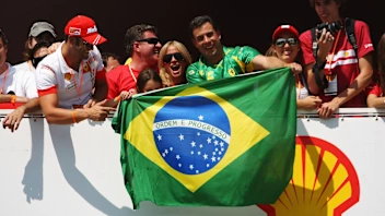 SAO PAULO, BRAZIL - OCTOBER 20:  Brazilian Ferrari fans unfurl their national flag during