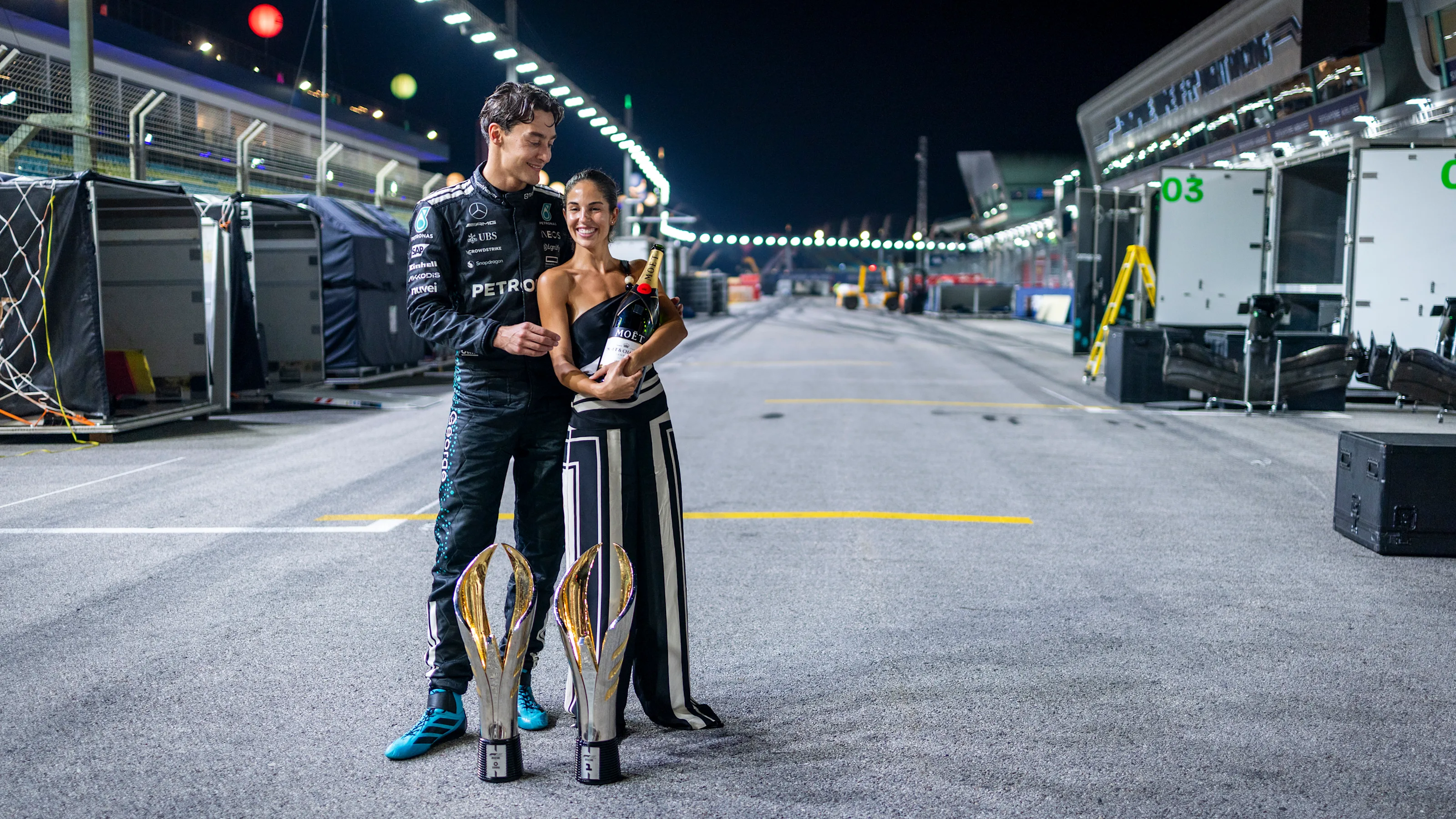 SINGAPORE, SINGAPORE - OCTOBER 05: Race winner George Russell of Great Britain and Mercedes AMG