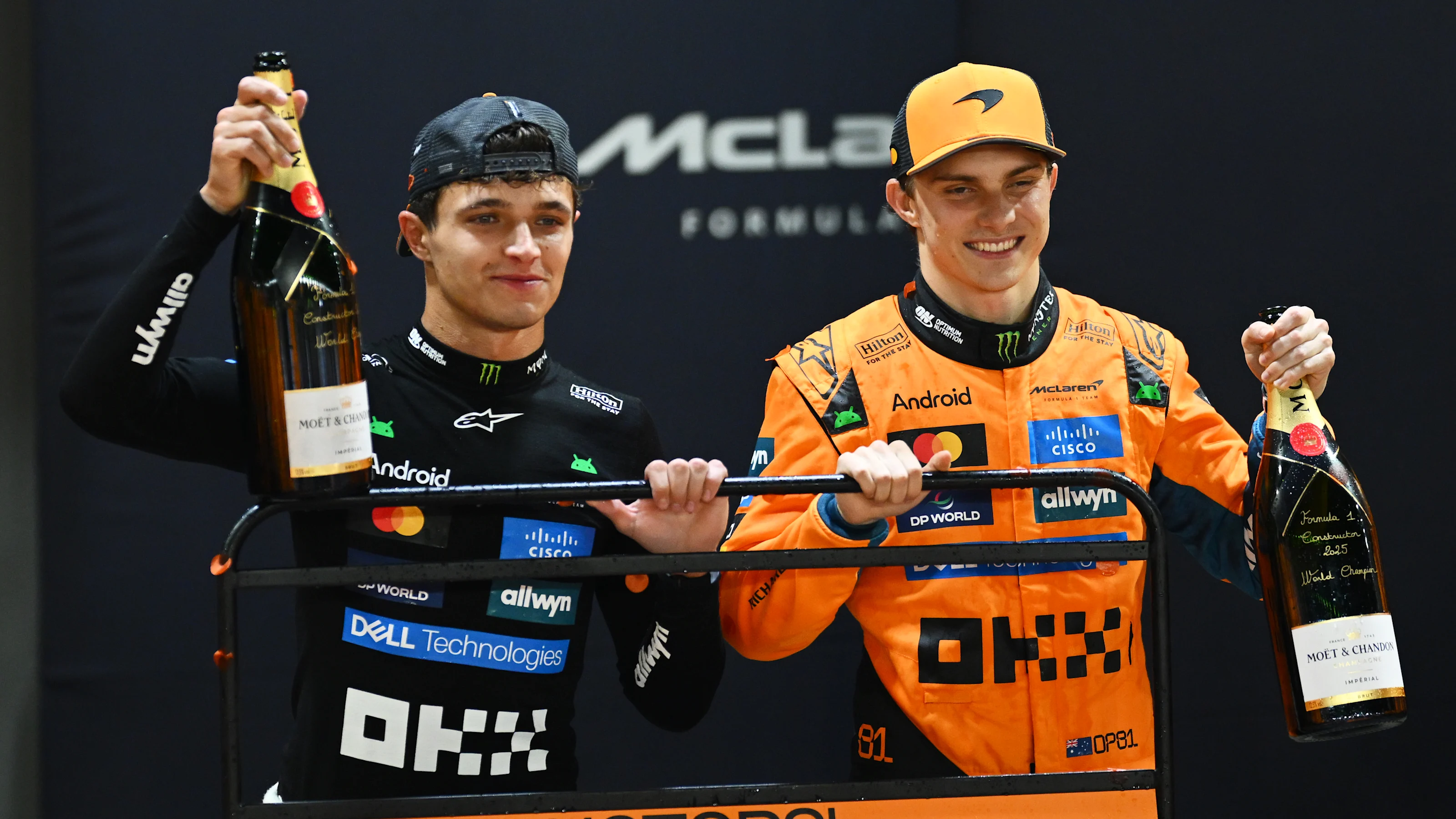 SINGAPORE, SINGAPORE - OCTOBER 05: Lando Norris of Great Britain and McLaren and Oscar Piastri of
