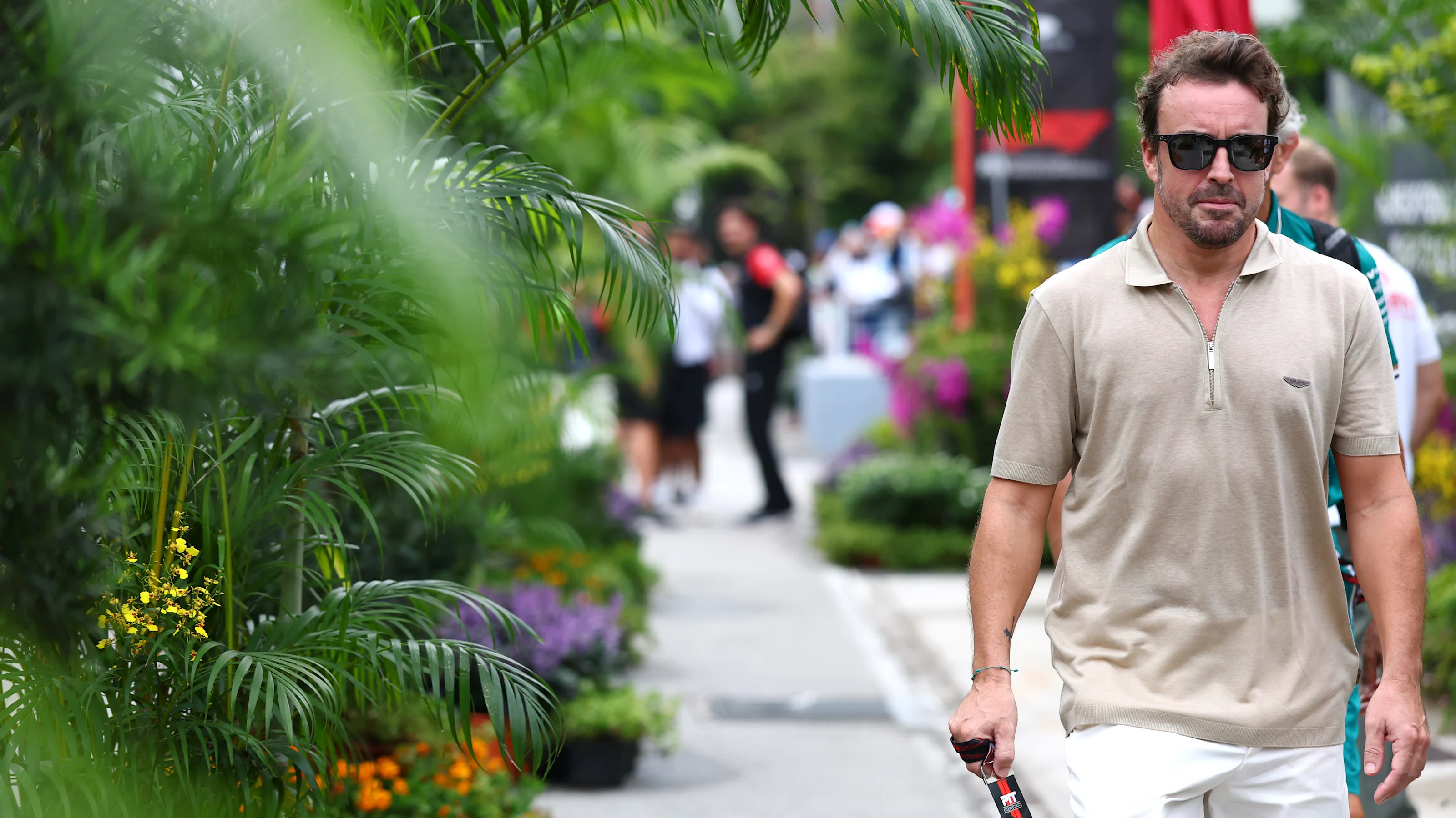 SINGAPORE, SINGAPORE - OCTOBER 02: Fernando Alonso of Spain and Aston Martin F1 Team arrives in the