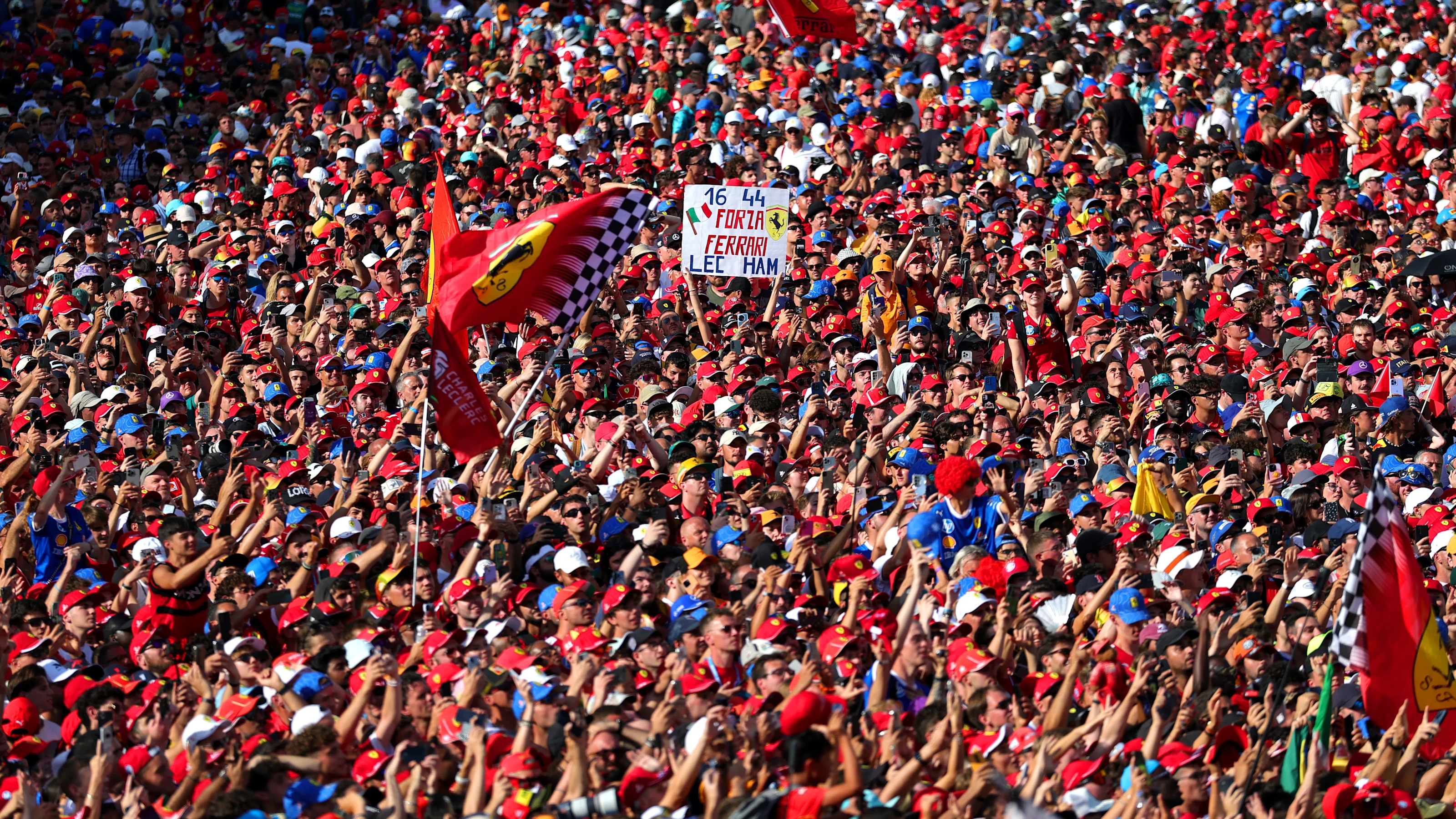 MONZA, ITALY - SEPTEMBER 07: Fans flood the circuit for the podium ceremony during the F1 Grand