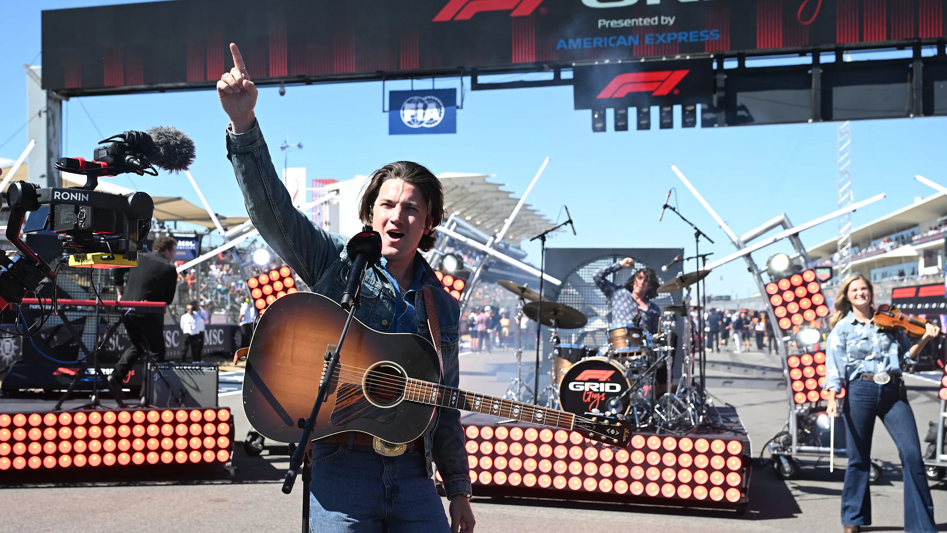 AUSTIN, TEXAS - OCTOBER 19: Drake Milligan performs on the grid during the F1 Grand Prix of United