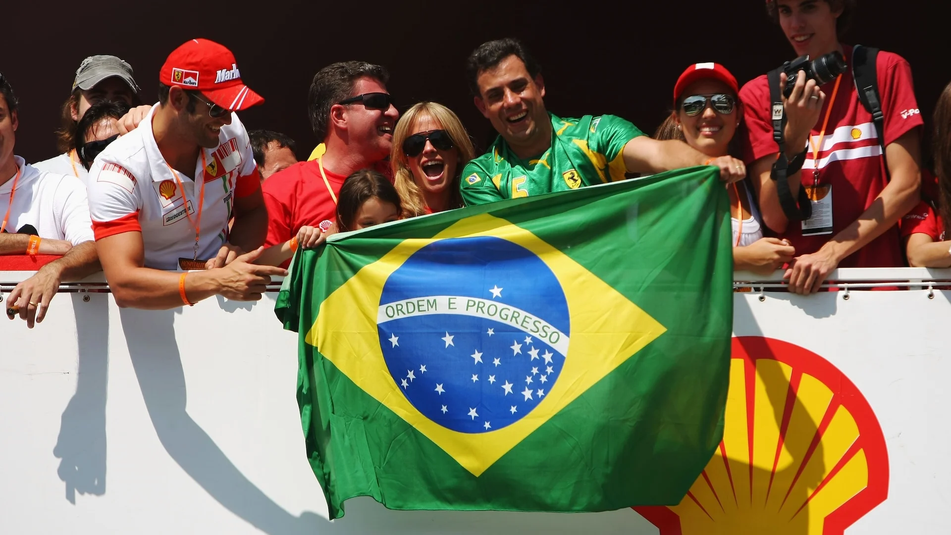 SAO PAULO, BRAZIL - OCTOBER 20: Brazilian Ferrari fans unfurl their national flag during