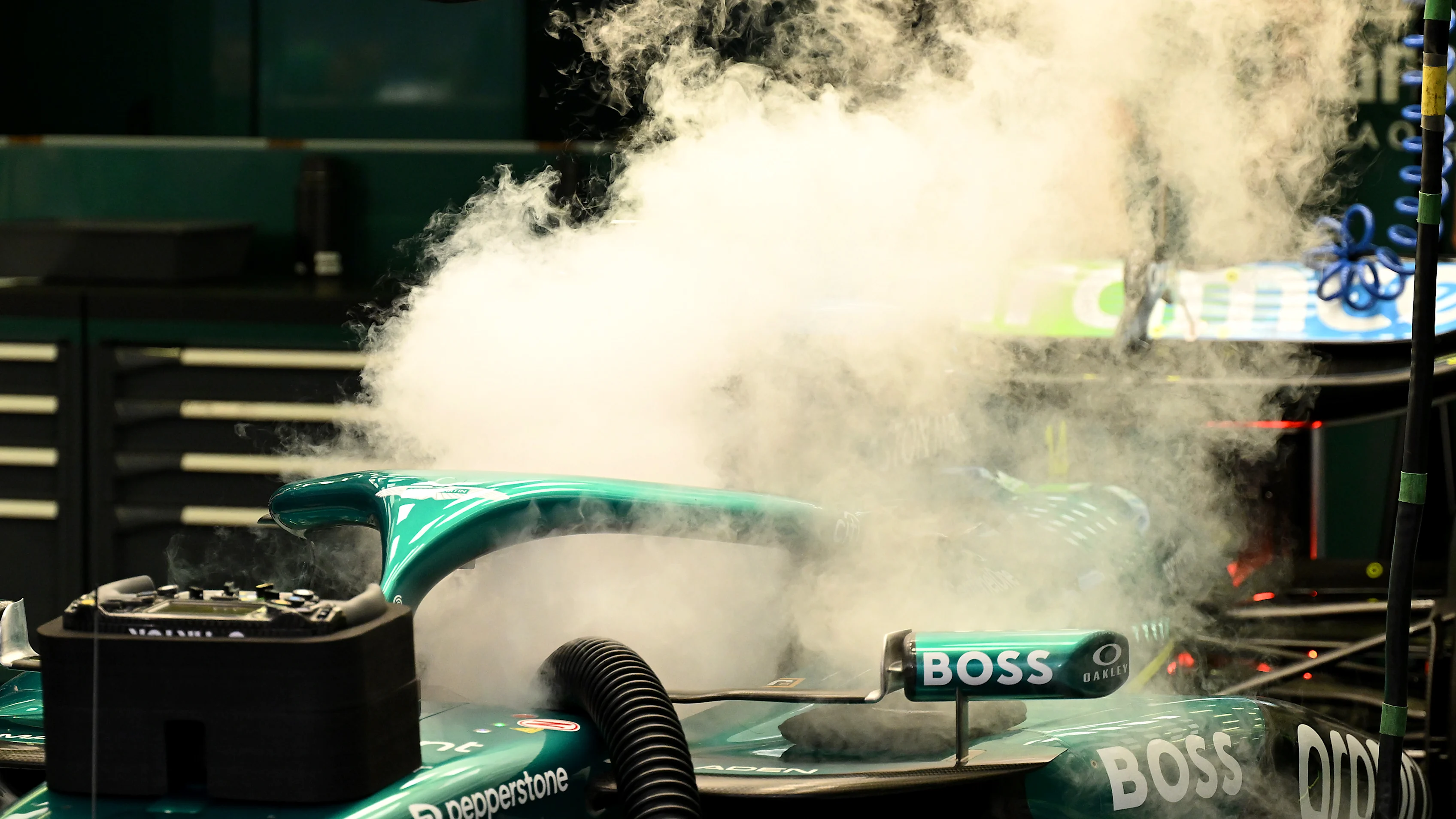 BAHRAIN, BAHRAIN - APRIL 11: Dry ice comes out of the cockpit of the Aston Martin F1 Team AMR25