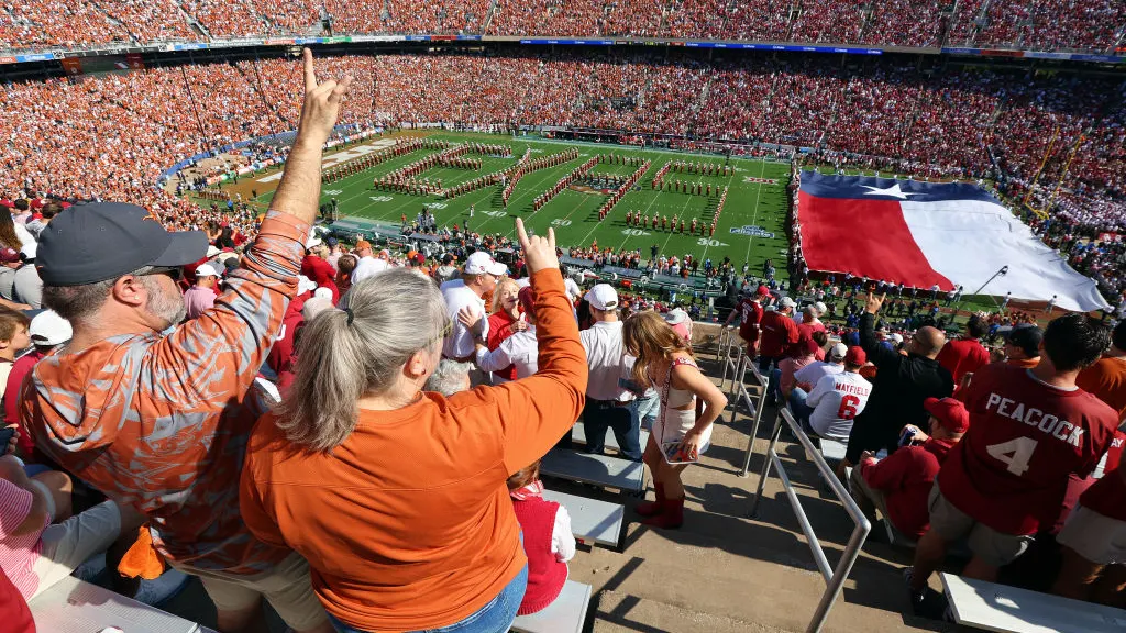 AUSTIN, TEXAS - OCTOBER 07: Texas Longhorns fans cheer as The University of Texas Longhorn Band