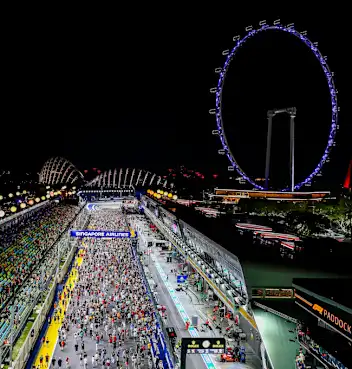 SINGAPORE, SINGAPORE - SEPTEMBER 22: Fans invade the track after the F1 Grand Prix of Singapore at