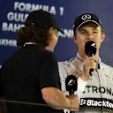 Nico Rosberg (GER) Mercedes AMG F1 is interviewed by Brian Johnson (GBR) AC/DC lead singer on the podium. Formula One World Championship, Rd3, Bahrain Grand Prix, Race, Bahrain International Circuit, Sakhir, Bahrain, Sunday, 6 April 2014. © Sutton Images