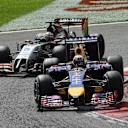 Daniel Ricciardo (AUS) Red Bull Racing RB10 leads Nico Hulkenberg (GER) Force India VJM07. Formula One World Championship, Rd13, Italian Grand Prix, Monza, Italy, Race Day, Sunday, 7 September 2014