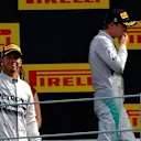 (L to R): Race winner Lewis Hamilton (GBR) Mercedes AMG F1 and second placed Nico Rosberg (GER) Mercedes AMG F1 on the podium. Formula One World Championship, Rd13, Italian Grand Prix, Monza, Italy, Race Day, Sunday, 7 September 2014