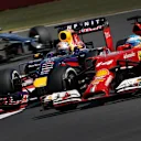 Sebastian Vettel (GER) Red Bull Racing RB10 and Fernando Alonso (ESP) Ferrari F14 T battle. Formula One World Championship, Rd9, British Grand Prix, Race Day, Silverstone, England, Sunday, 6 July 2014