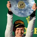 Third placed Kevin Magnussen (DEN) McLaren, with his trophy on the podium. Formula One World Championship, Rd1, Australian Grand Prix, Race, Albert Park, Melbourne, Australia, Sunday, 16 March 2014