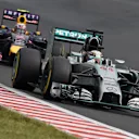 Lewis Hamilton (GBR) Mercedes AMG F1 W05 leads Daniel Ricciardo (AUS) Red Bull Racing RB10. Formula One World Championship, Rd11, Hungarian Grand Prix, Race Day, Hungaroring, Hungary. Sunday, 27 July 2014