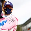 Sergio Perez, Racing Point, talks with team mates on the pit wall