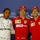 SINGAPORE, SINGAPORE - SEPTEMBER 21: Top three qualifiers Charles Leclerc of Monaco and Ferrari, Lewis Hamilton of Great Britain and Mercedes GP and Sebastian Vettel of Germany and Ferrari celebrate in parc ferme during qualifying for the F1 Grand Prix of Singapore at Marina Bay Street Circuit on September 21, 2019 in Singapore. (Photo by Will Taylor-Medhurst/Getty Images)